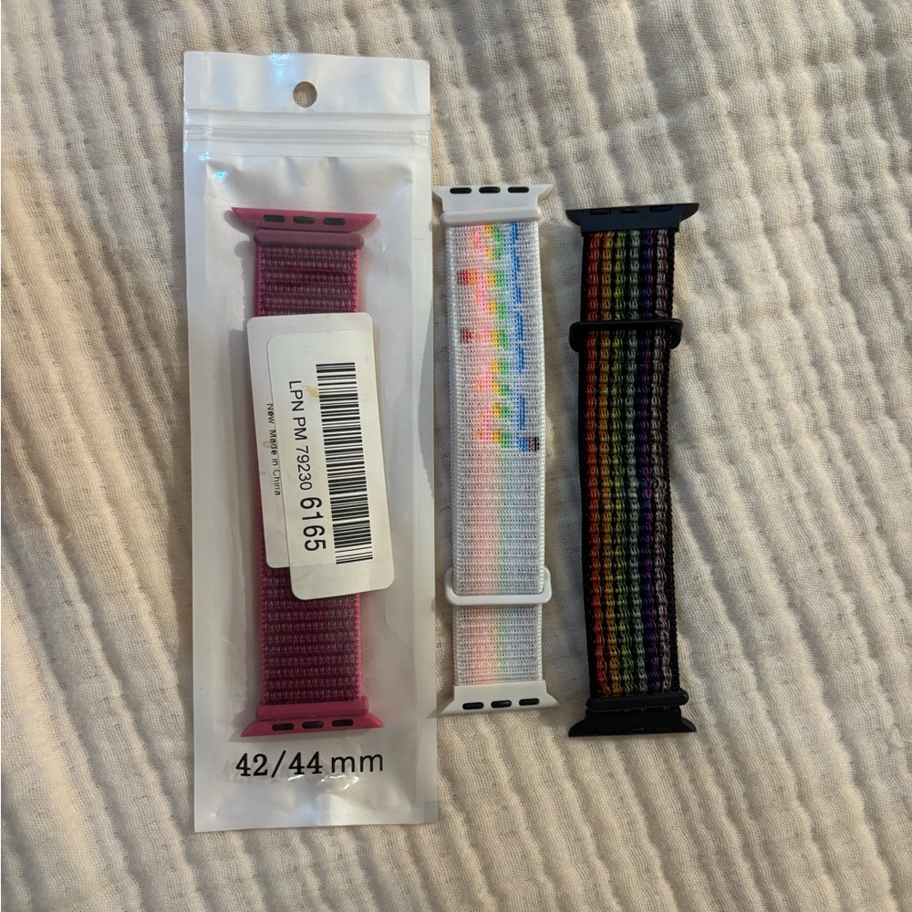 Set of Three Apple Watch Bands in Pink, White, and Multicolor